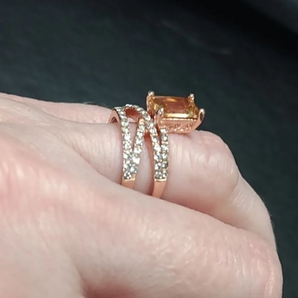 Rose gold colored ring with champagne stone Size 6